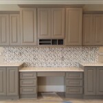 gray kitchen cabinets desk area