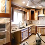 masked kitchen cabinets ready to be sprayed